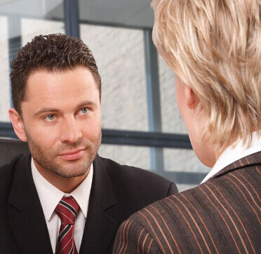 a salesperson listening carefully to a client